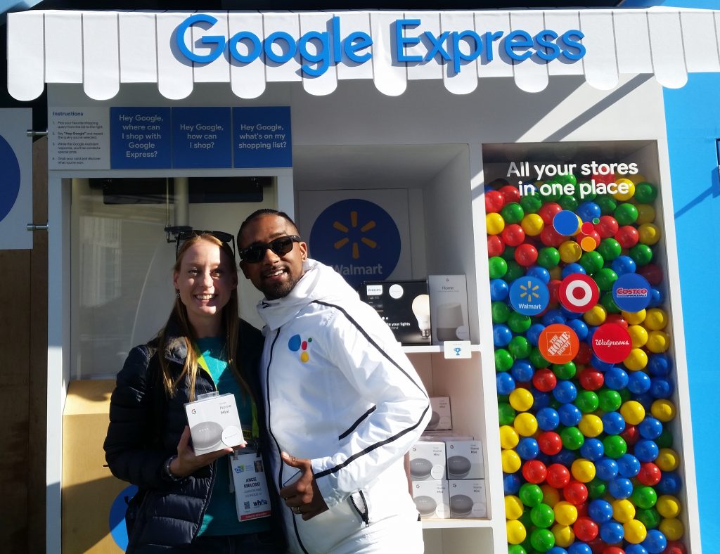 Image of Angie Kibiloski Winning Google Home Mini at Google Express Booth