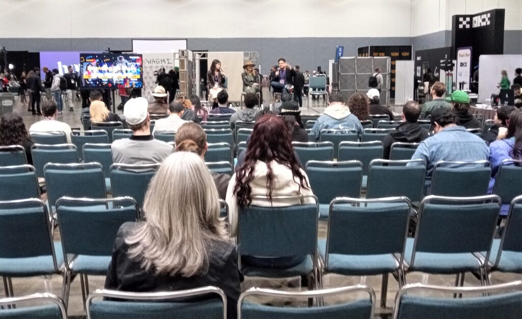 View from behind the audience of the Extending the Chain Panel