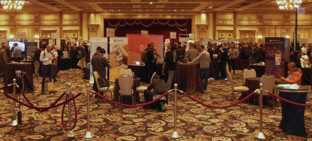 ShowStoppers booths and attendees from the event ballroom entrance.