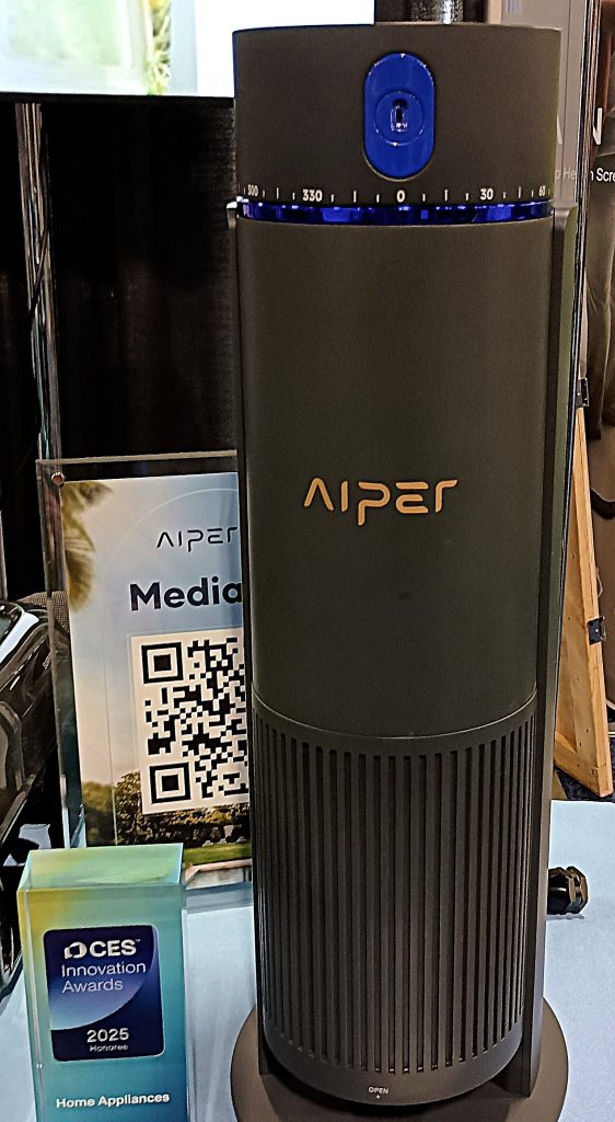 Aiper IrriSense smart sprinkler displayed on tabletop with CES Innovation Award sign.