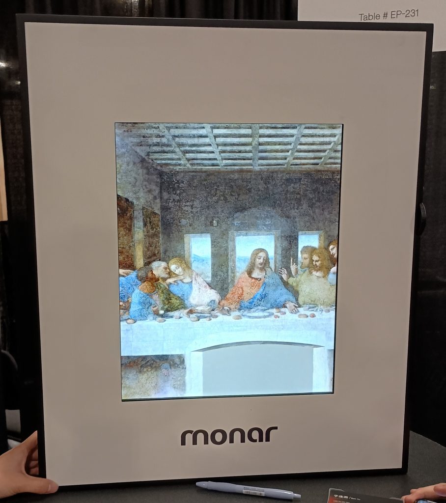 Monar Canvas Speaker sitting on a tabletop displaying an AI generated artwork based on The Last Supper.