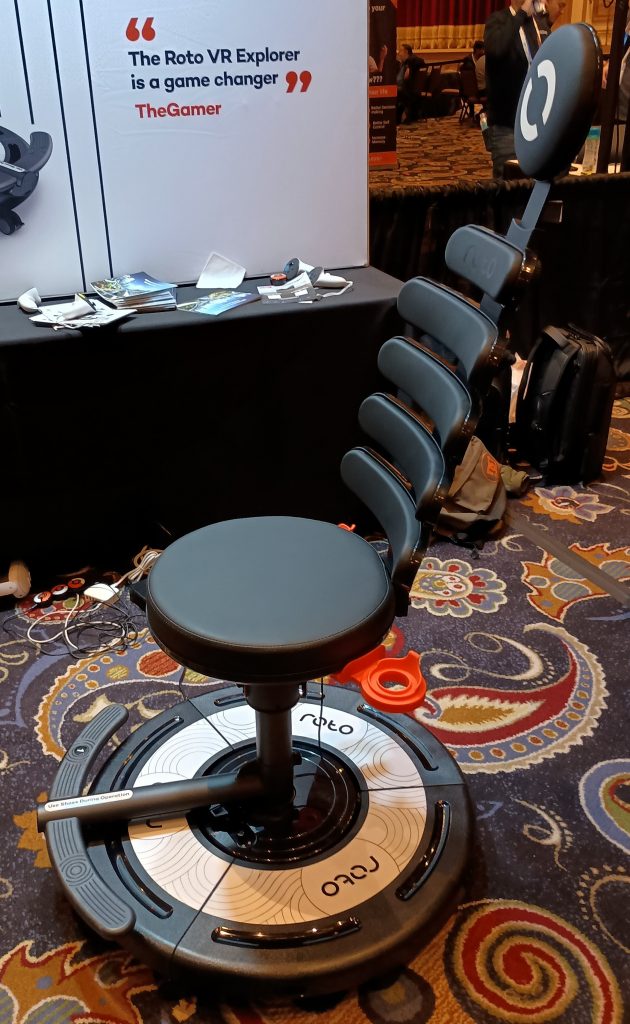 Roto VR Explorer gaming chair in front of the Roto VR booth.