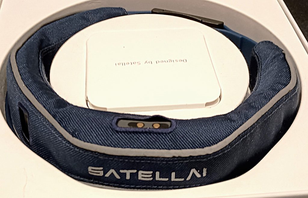 Blue fabric SATELLAI Collar resting in its white product box.