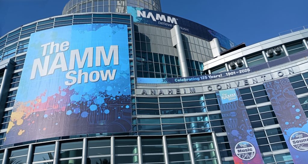 The NAMM Show banner on the glass fronted Anaheim Convention Center building.